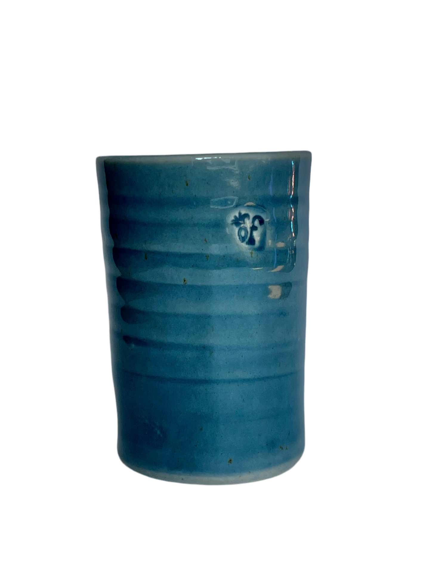 Handcrafted pottery tumblers by Of Cabbages and Kings in earthy tones, showcasing unique textures and shapes.
