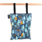 Colibri Canada reusable wet bag in vibrant pattern, showcasing waterproof fabric and secure zipper closure.