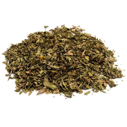 Peppermint tea leaves in a loose form from Jolene's Tea House, showcasing vibrant green and aromatic fresh leaves.