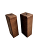 Handcrafted wooden vases by Handcrafted By TA, showcasing unique grain patterns and elegant shapes in natural wood finish.