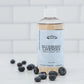 Suntree Soaps bubble bath in a clear bottle with colorful bubbles and a relaxing setting for a soothing bath experience.