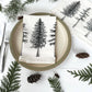 Set of colorful reusable napkins from Your Green Kitchen displayed on a wooden table, showcasing eco-friendly dining options.