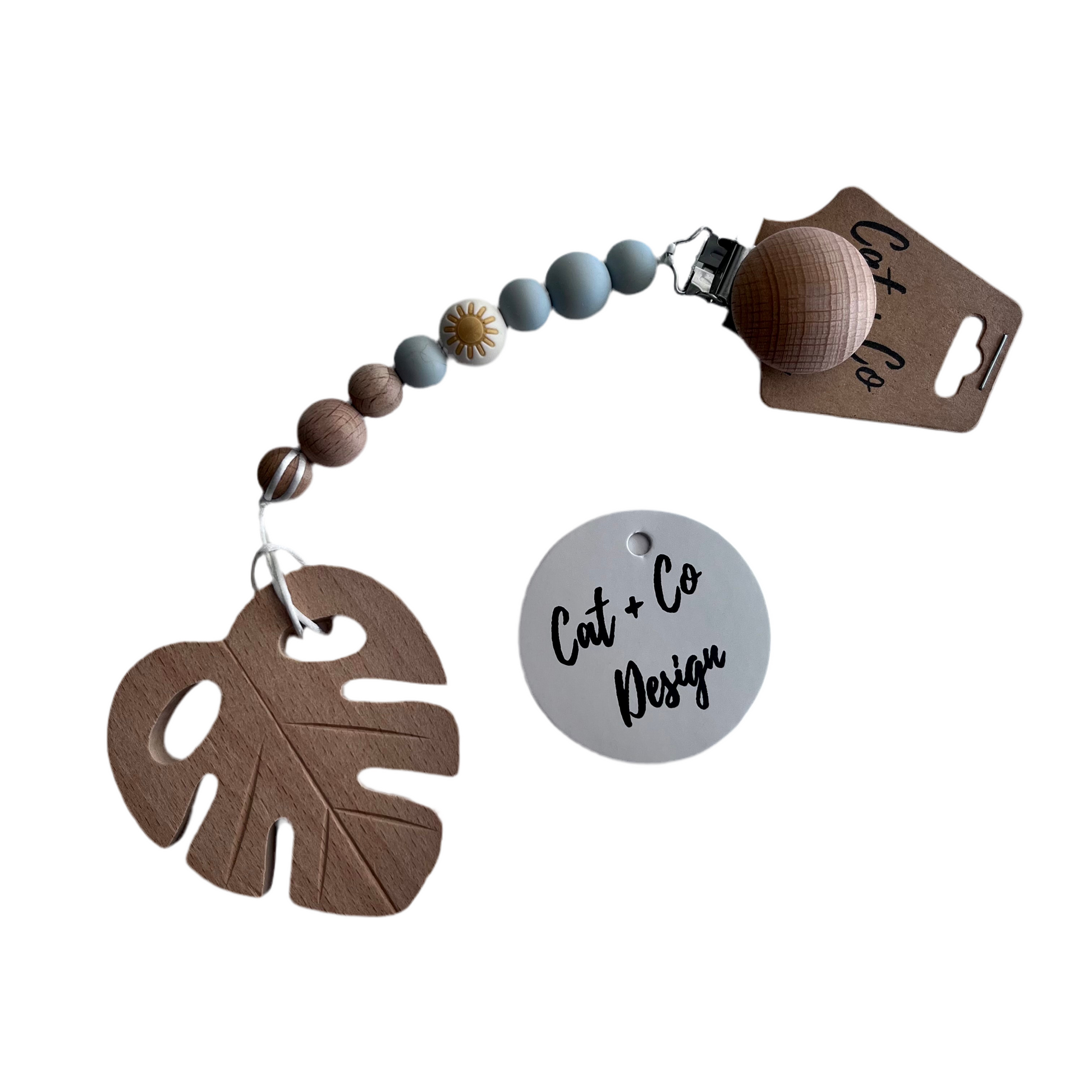 Cat & Co Design baby pacifier clips in various colors, securely holding pacifiers with stylish and functional designs.