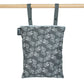 Colibri Canada reusable wet bag in colorful patterns, ideal for storing wet items or snacks on the go.