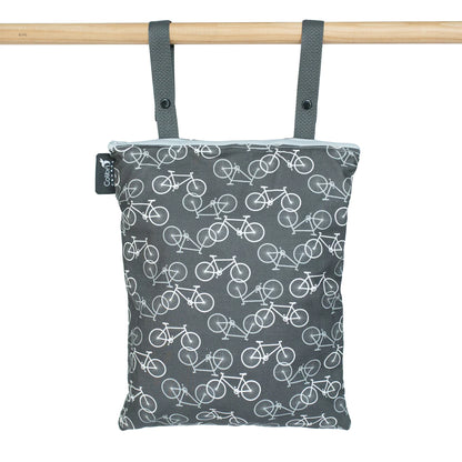 Colibri Canada reusable wet bag in colorful patterns, ideal for storing wet items or snacks on the go.