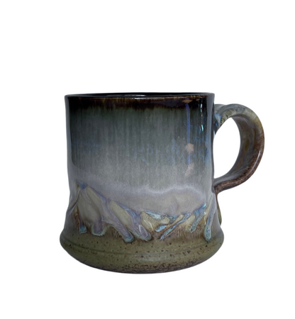 Handcrafted Mountain Pottery mugs by Of Cabbages and Kings, featuring earthy tones and rustic textures.