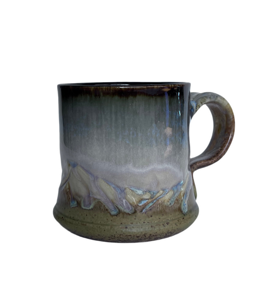 Handcrafted Mountain Pottery mugs by Of Cabbages and Kings, featuring earthy tones and rustic textures.
