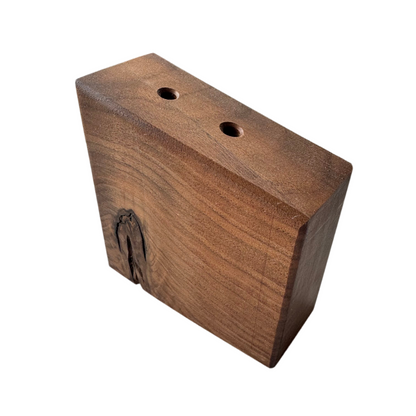 Handcrafted wooden vases by Handcrafted By TA, showcasing unique grain patterns and elegant shapes.