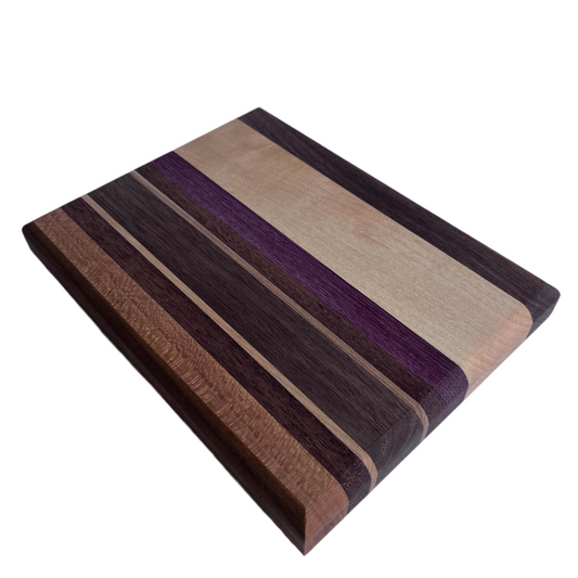 Wooden chopping board with various wood types.