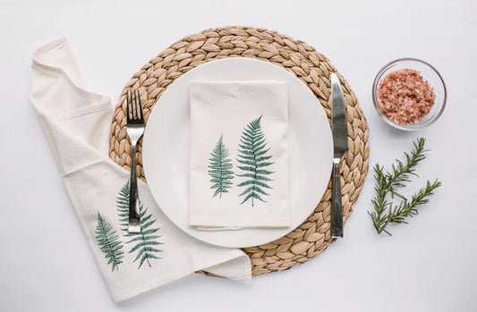 Reusable fern-patterned napkins from Your Green Kitchen, showcasing a vibrant green design for eco-friendly dining.